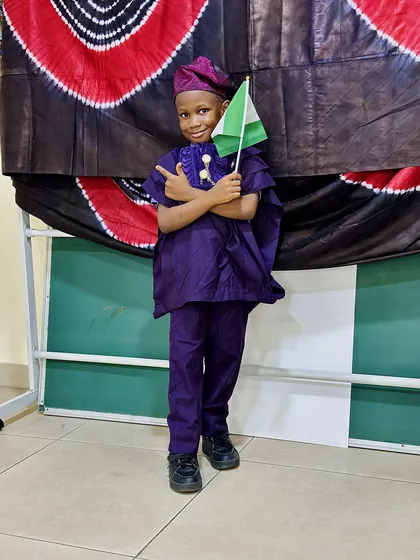 A child dressed in Nigerian colours celebrating Independence Day at Aquila Nidus