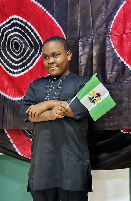 A child dressed in Nigerian colours celebrating Independence Day at Aquila Nidus