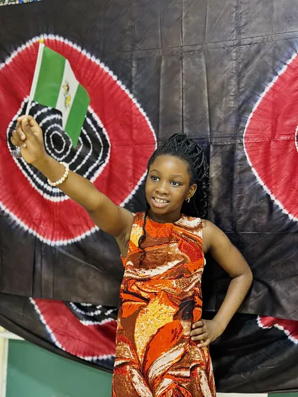 A child dressed in Nigerian colours celebrating Independence Day at Aquila Nidus