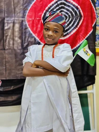 A child dressed in Nigerian colours celebrating Independence Day at Aquila Nidus