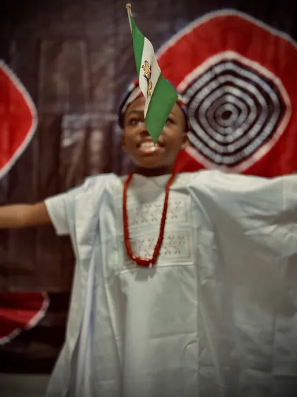 A child dressed in Nigerian colours celebrating Independence Day at Aquila Nidus