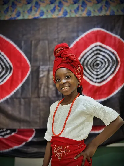 A child dressed in Nigerian colours celebrating Independence Day at Aquila Nidus