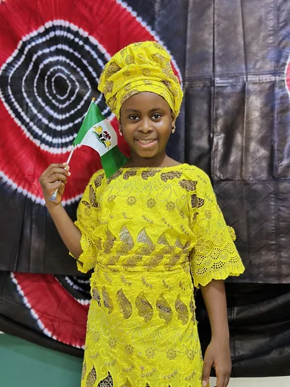 A child dressed in Nigerian colours celebrating Independence Day at Aquila Nidus