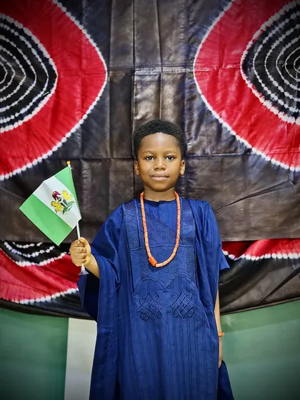 A child dressed in Nigerian colours celebrating Independence Day at Aquila Nidus