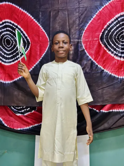 A child dressed in Nigerian colours celebrating Independence Day at Aquila Nidus
