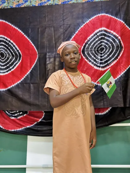 A child dressed in Nigerian colours celebrating Independence Day at Aquila Nidus